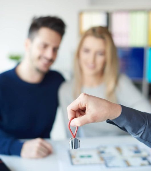 close-up-key-ring-and-couple-in-the-background-2023-11-27-04-59-09-utc-2