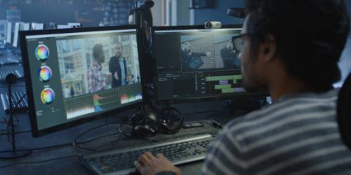 Medium close-up of a film editor working on a movie