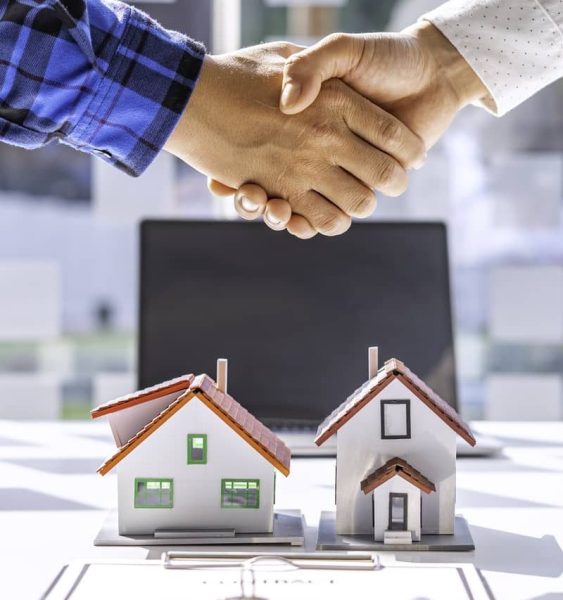 real-estate-agents-and-clients-shake-hands-and-del-2023-11-27-05-00-35-utc-2